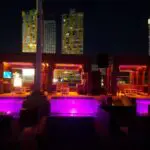 A rooftop pool is lit up with mesmerizing purple lights, creating a spectacular ambience for any SPECIALTY event.