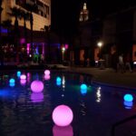 A rental pool with LED lighted orbs.