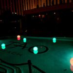 Tao beach pool at night with LED pool orb rental.