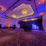 Uplight Rentals in Las Vegas offers a stunning ballroom adorned with blue and white lighting.