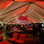 A red-themed event with hanging lights