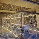 A tunnel of lights inside a wedding hall