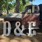 The Marquee letters D and E are parked in front of a truck