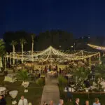 An outdoor setup with cocktail tables