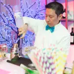 The bartender mixing a cocktail