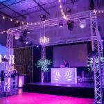 A specialty event lighting set up in a large room with lights.