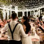 A couple looking at the reception setup for their wedding