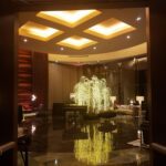 The lobby of a hotel is illuminated with vibrant event lighting at the Las Vegas strip.