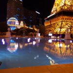 The Eiffel Tower is reflected in the pool at Event Lighting at the Las Vegas strip.