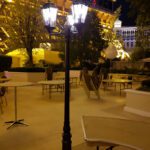 An event lighting lamp post in the middle of a parking lot at the Las Vegas strip.