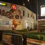 The walls of a food establishment with hanging lights