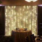 Event lighting illuminating a table against the backdrop of the Las Vegas strip.