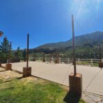 An event lighting adorned wooden deck with a breathtaking view of the mountains at Mt Charleston Las Vegas.