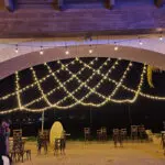 Event Lighting at Lake Las Vegas Sports Club with a wedding reception under a string of lights.