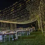 Event Lighting at Lotus House Las Vegas, with string lights illuminating the wedding reception.