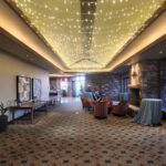 The lobby of an Event Lighting at Red Rock Country Club Las Vegas hotel is decorated with string lights.