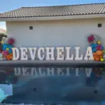 A pool with balloons and a sign that says devella, available for Marquee Letter Rental.