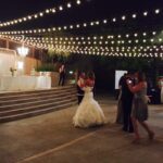 Two couples dancing on the floor