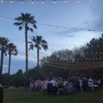 An enchanting wedding reception at the JW Marriott Las Vegas, adorned with mesmerizing string lights and complemented by the majestic presence of palm trees. Our event lighting expertise will transform your special day