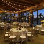 A wedding reception set up with tables, chairs, and event lighting at CiliLake Las Vegas.