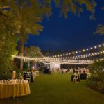 Event Lighting at a wedding reception with string lights and palm trees at the JW Marriott Las Vegas.