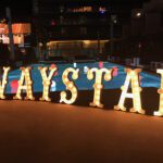 A sign that says waystar at a poolside event.